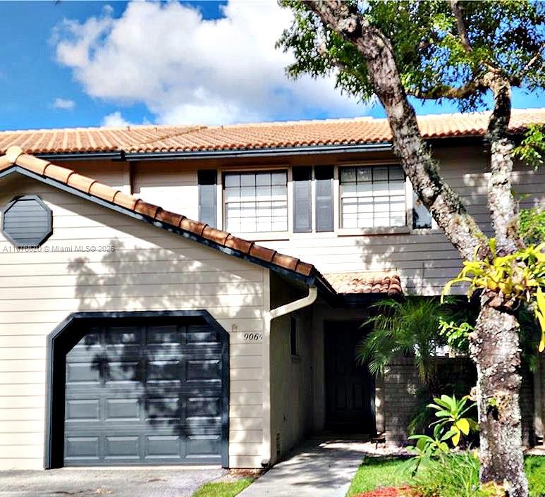 Absolutely beautiful AND AFFORDABLE 3 bedroom, 2.5 bath townhome with garage in the Vineyards of Plantation! From the moment you enter this freshly painted 3 bedroom 2.5 bath retreat, peaceful LAKE VIEWS set the tone. The open living and dining areas flow into a stunning kitchen with wood shaker cabinets, granite counters, marble backsplash, pantry and an island with storage. Enjoy morning coffee on the screened patio overlooking the water. Upstairs are 3 spacious bedrooms & the laundry for added convenience. The master suite offers a screened balcony with lake views & a spa-like bath with dual sinks & soaking tub. With new IMPACT windows, crown molding through out, newer A/C, fresh paint, lush landscaping, tasteful design & convenient location to all highways…this home is truly special!