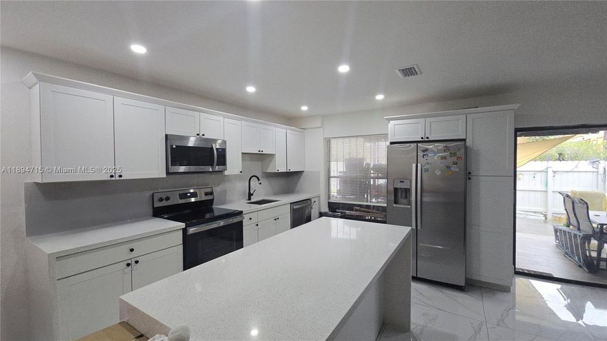 ONLY 2 MONTHS REQUIRED FOR MOVE-IN!!! Newly and beautifully REMODELED 4 Bedroom 3 Bath located in the highly sought after Lago Grande.  This home features a new kitchen with white wood cabinets, kitchen island with quartz countertops, stainless steel appliances, tiled floors, a full bedroom and bath downstairs, covered patio, walk in closets, full size washer and dryer.  Call today, this one will go fast!