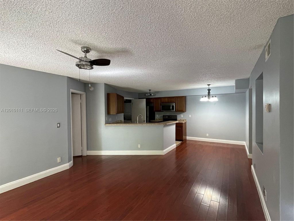 Photo of 9999 Summerbreeze Dr #717, Sunrise, FL 33322 (MLS # A12010111)