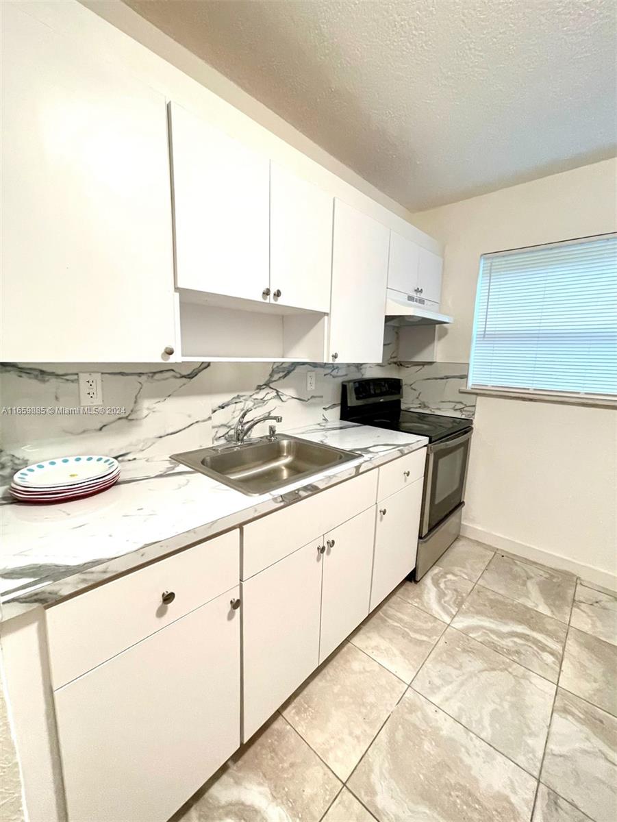 Completely renovated 2-bedroom, 1-bathroom apartment in a prime location! Just 2 minutes from Wynwood Walls, you're far from restaurants, cafes, and stores. Only 15 minutes to Downtown Miami, 6 minutes to the Design District, and 5 minutes to Midtown. Rent includes water and parking. Extra furniture can be removed upon request. This calm and safe building is family-oriented, offering a peaceful living environment. Pets are not allowed, and laundry facilities are conveniently across the street. Easy to show—schedule a viewing with me today!