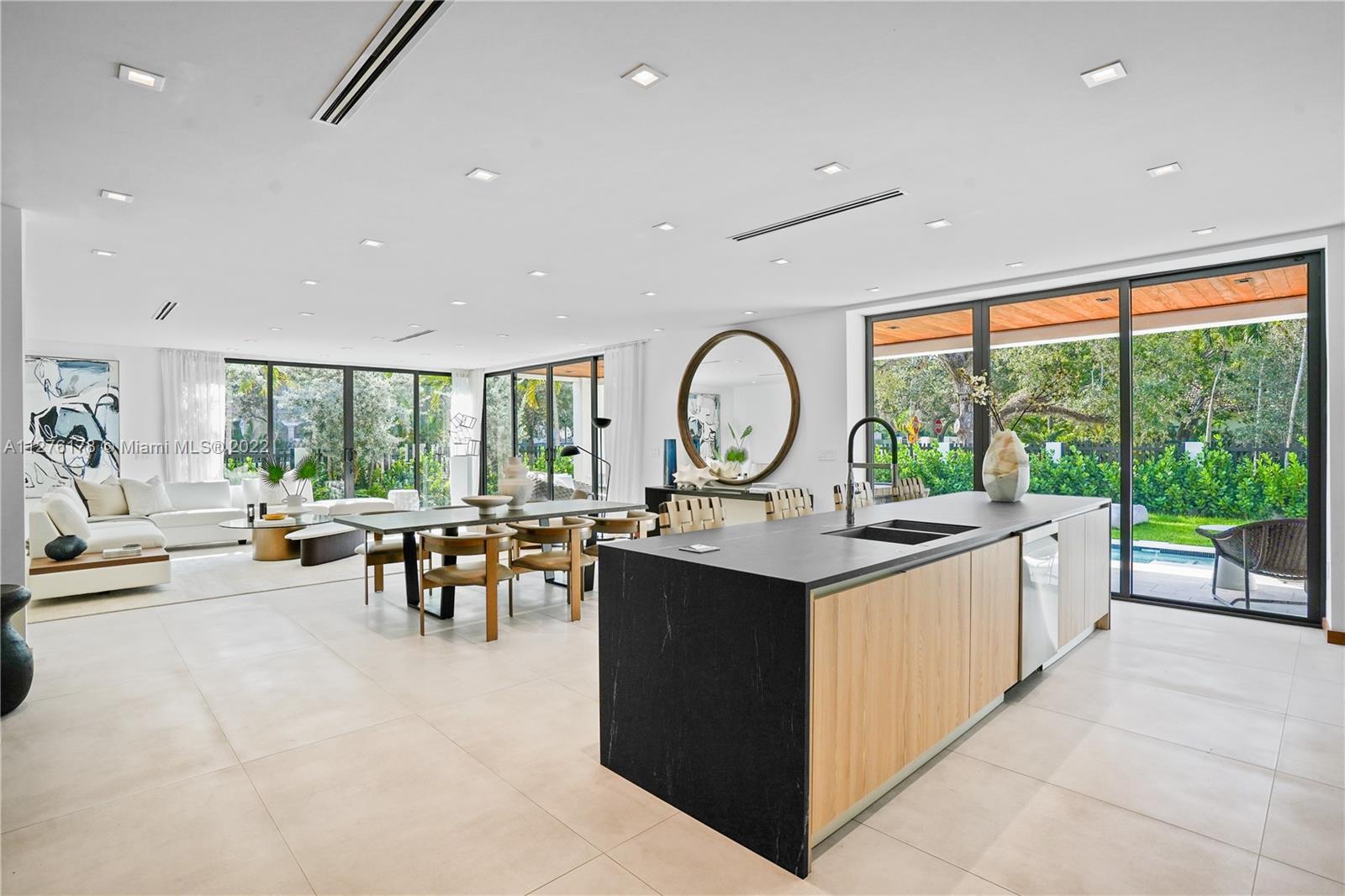 Stunning, brand new home exquisitely designed combining stone, porcelain, and wood elements within a beautiful 4,650sqft interior space. The house contains 5 spacious bedrooms each with its own bathroom and features a wide open floor plan with a kitchen overlooking the living and dining room. Additional features also include floor-to-ceiling windows allowing an abundance of natural light, a sleek, modern pool & spa, expansive second story terrace, and gated entry. Situated on a corner lot along the historic Tigertail Ave, the shops and restaurants in Downtown Coconut Grove along with the best schools in Miami are just 2 minutes away.