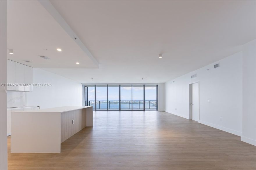 Skyview Villa 5402 at Aria Reserve South offers a cinematic panorama of Biscayne Bay, Miami Beach, and the Atlantic. Two private elevators open to a proper foyer and a vast flow through great room that opens to an oversized terrace for dining and lounging. Four en suite bedrooms plus an office, five full baths and a powder room. Floor to ceiling glass, upgraded floors, and an open kitchen anchor the living area. Two side by side parking spaces. Aria Reserve adds resort caliber amenities including marina, spa, fitness, sports courts, concierge, and sky lobby with lounge and wine room. Minutes to Design District, Brickell, Downtown, Wynwood, and Miami Beach. Interiors by Morada Haute Design.