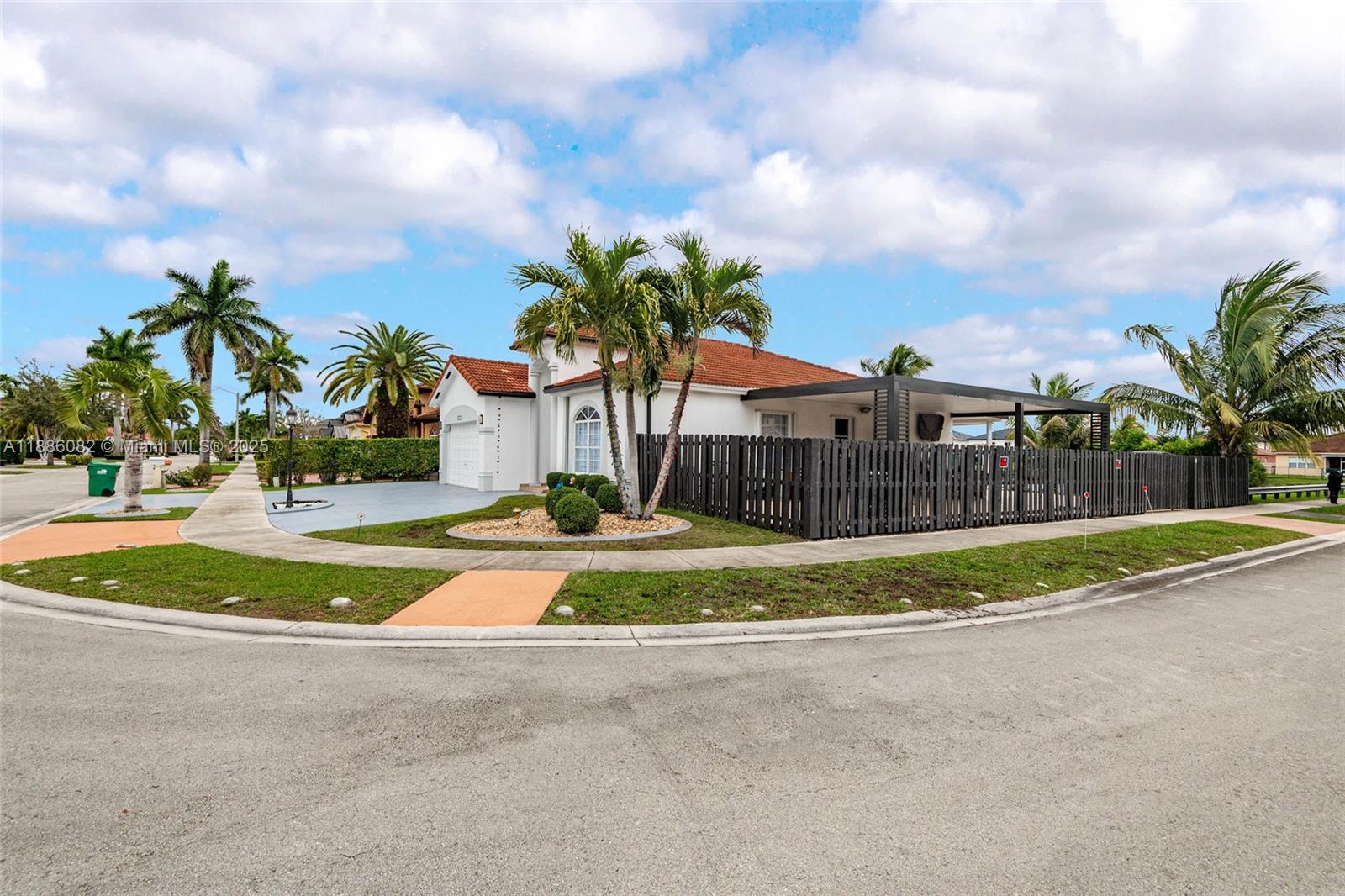 Beautiful Waterfront corner lot home with great lake views, Bring RV or boat (it fits ) ;No Association, 4 bedrooms 2 bathrooms and 2 half bathrooms, 2 car garage, large kitchen and family room, bathrooms recently remodeled, zebra blinds, new AC unit, new front impact doors, freshly painted, artificial turf on one side, huge pergola newly installed pergola perfect for entertaining, swarovski crystals chandeliers, French doors, big master bedrooms with California closets, and good size bedrooms, enjoy the afternoons with a lake view from the family room and kitchen. An absolute dream to show. Ready for a family to move in. This opportunity won't last!!!