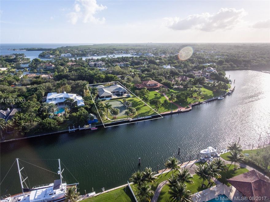 Incredible opportunity to build your dream home on a 1.3 acre lot in the esteemed gated community of Gables Estates with 160 ft. of spectacular waterfront. Unobstructed access to Biscayne Bay makes this home a boater’s dream. Beautiful wood and marble floors are used throughout the home which includes expansive living areas and master suite with sitting room. Large impact windows and volume ceilings allow natural light to fill the interior. Great for entertaining, the home features a swimming pool, large yard, and tennis court.