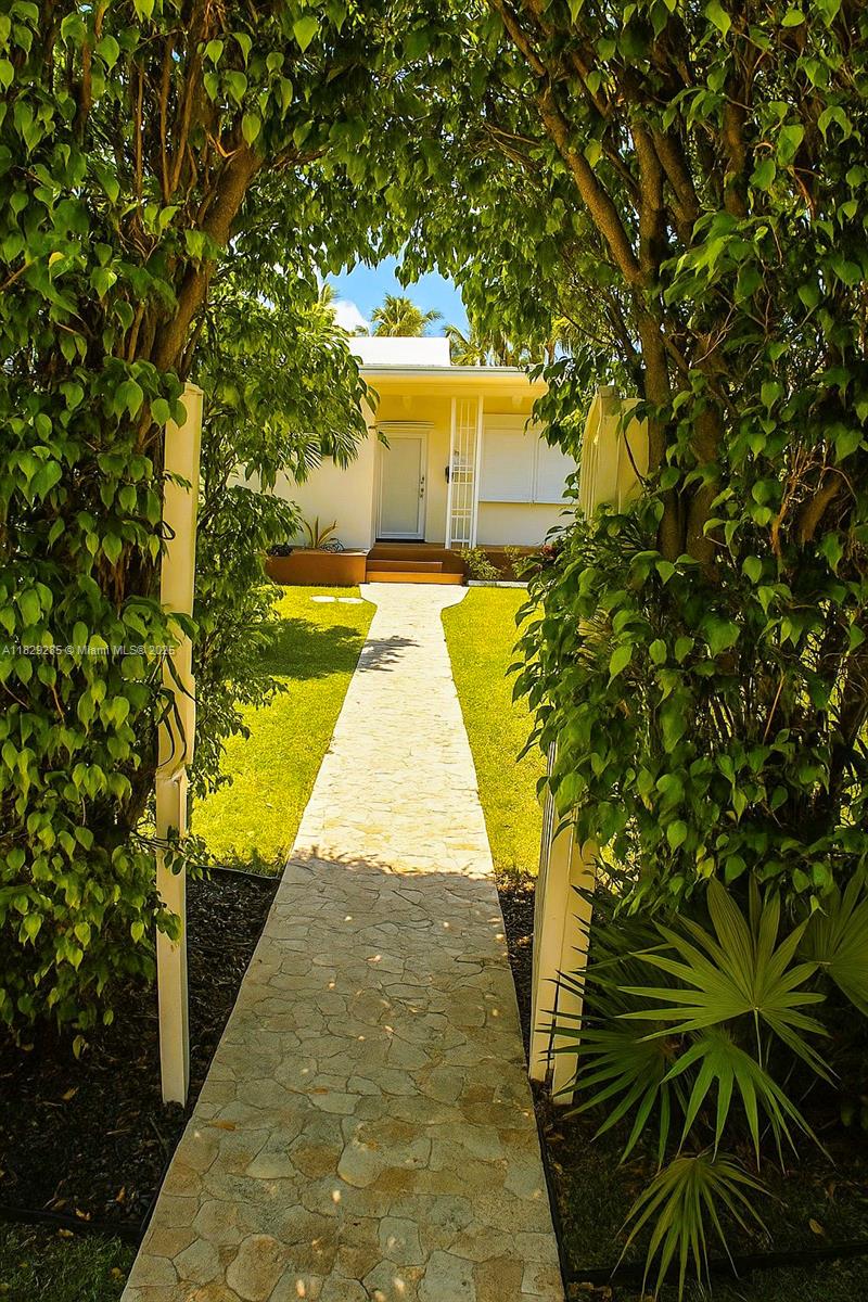 Beautifully 3/3 designer house located at Normandy Isle with a large fenced dock and ocean access ....being offered fully furnished. Spacious kitchen, travertine flooring with laundry, hardwood flooring bedrooms and amazing patio with pool, barbecue grill and tropical palms. Enjoy a gorgeous paradise tropical garden oasis with 65feet of water frontage including next to canal. Conveniently located at the heart of Normandy Isle walking distance from restaurants and shopping area and just minutes from the beach...... Gated fenced private parking for 2 cars with extra guess parking outside at a quiet neighborhood.