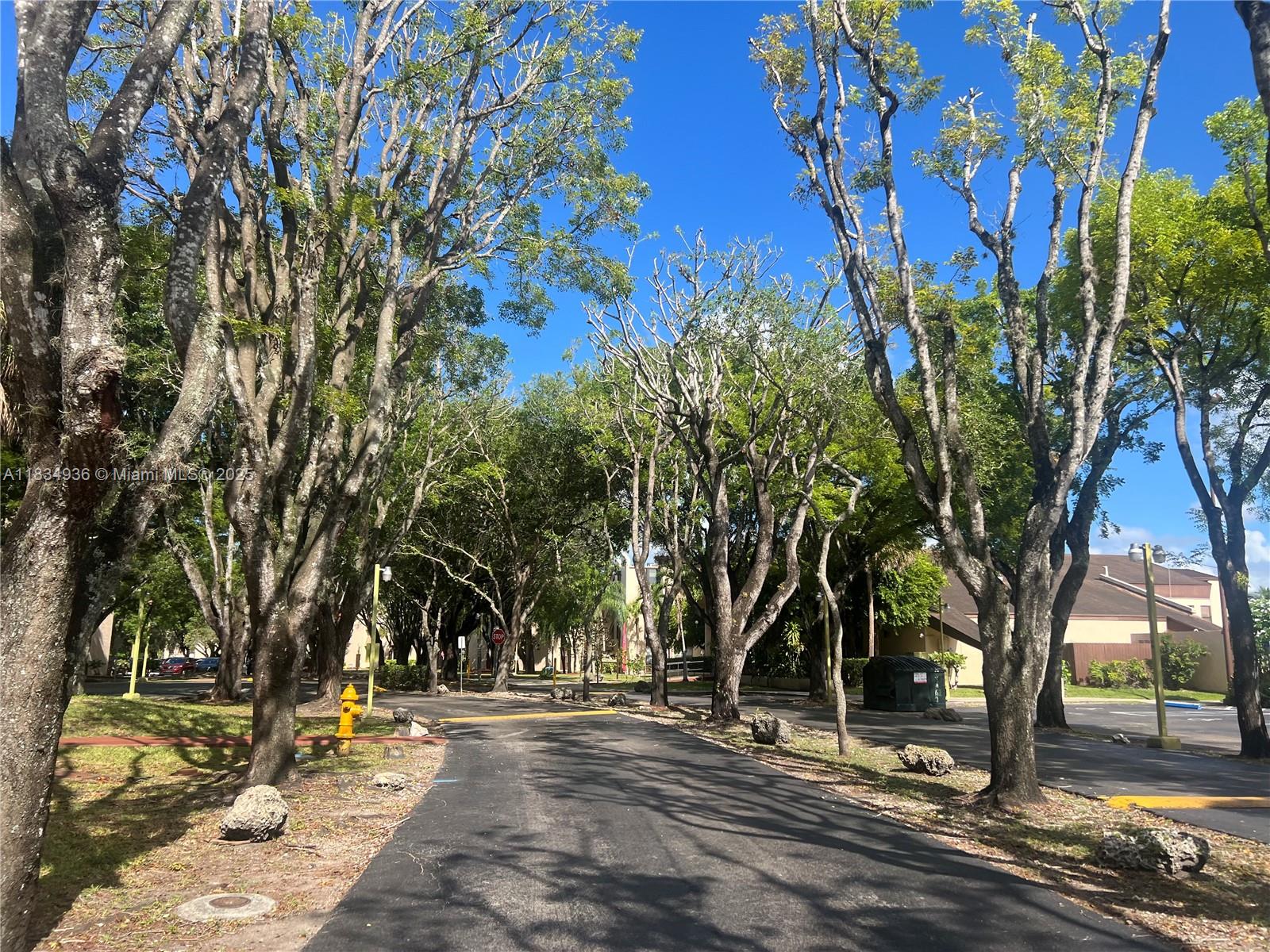 Nice condo in the heart of Kendall, surrendered by trees and lake. Gated community with 24 hr. security. Very desirable 1st floor unit, split plan with 2 bedrooms, 2 bathrooms and full size washer and dryer inside located on the balcony closet. Freshly painted. One parking space assigned; plenty of guests parking, up to 3 cars total allowed for two bedroom unit, tiles throughout, water included, and amenities: pool, tennis courts, jogging path, lake. No pets allowed as per association.