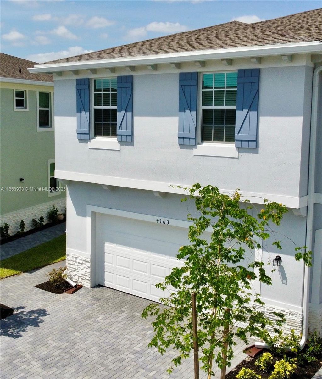 Photo of 4163 Lagoon Shore Dr #4163, Lake Worth, FL 33467 (MLS # A11856908)