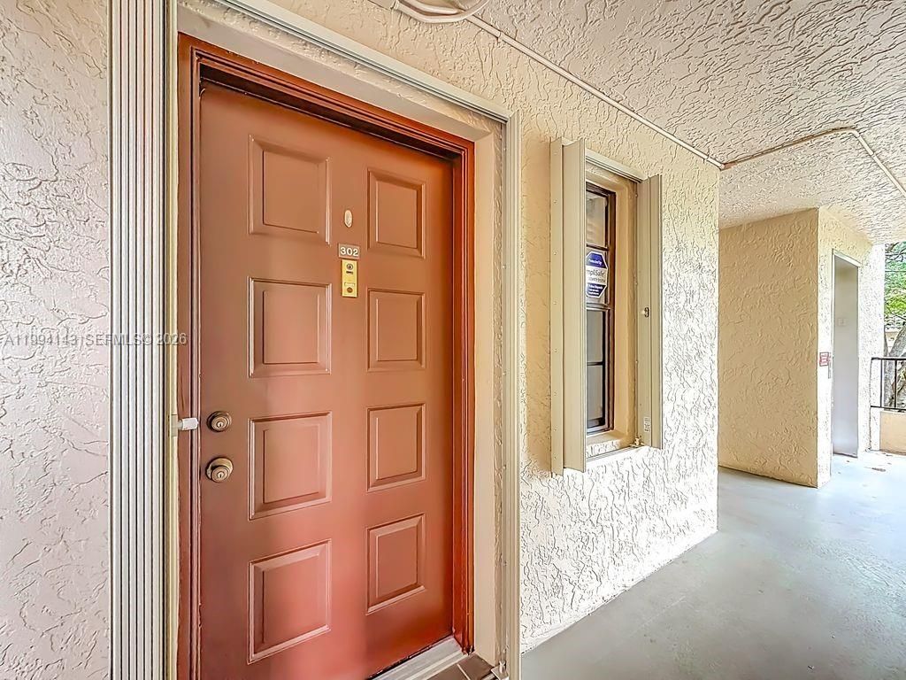 Photo of 10401 W Broward Blvd #302, Plantation, FL 33324 (MLS # A11994143)