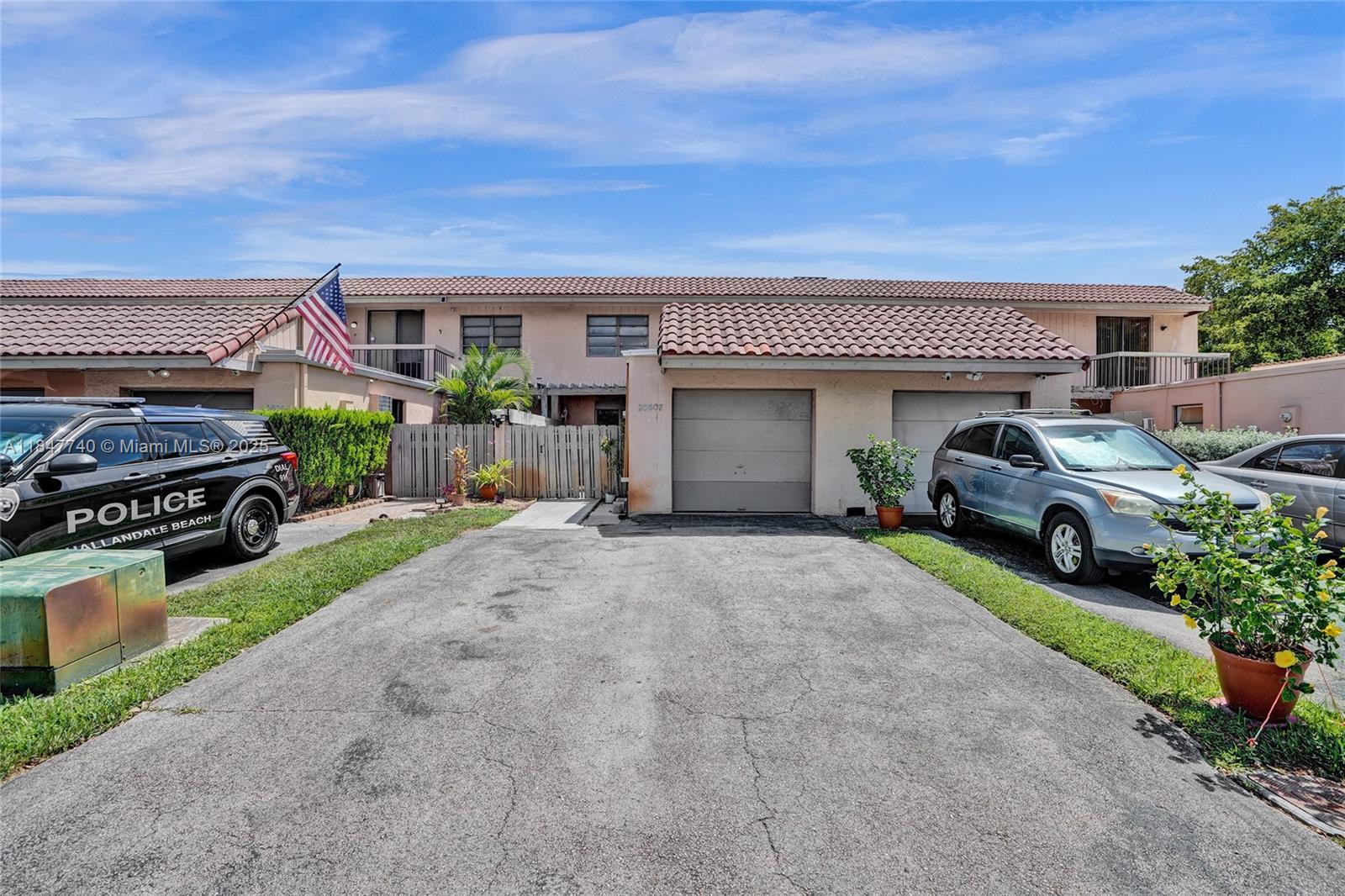 Welcome to this spacious and updated 3-bedroom, 2.5-bath townhouse in the desirable Golfwood at California Club community. This 2-story home offers over 2,100 SF of living space, a 1-car garage, and a large driveway for added convenience. Inside, you’ll find an inviting first-floor layout with tile floors, a bright kitchen with modern appliances, and a flexible dining/family area that flows seamlessly to your private fenced patio — perfect for relaxing or entertaining. Upstairs, the oversized primary suite features a walk-in closet, ensuite bath with separate tub and shower, and plenty of natural light. Enjoy a peaceful, well-maintained neighborhood with access to a community pool, all just minutes from I-95, Aventura Mall, Hard Rock Stadium, beaches, parks, and top-rated schools.