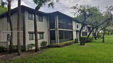 Photo of 9459 W Mcnab Rd #215, Tamarac, FL 33321 (MLS # A11888690)
