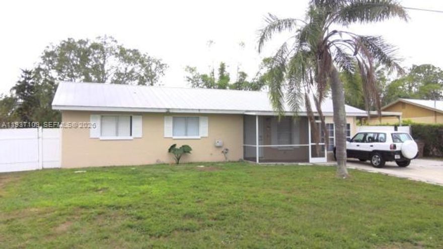 Charming 3-bedroom, 2-bathroom home with a 1-car garage in a prime Lehigh Acres location near Lee Boulevard. Priced as the lowest in the area, this property features a 2022 metal roof, new well pump and softener,  tile flooring, and renovated bathrooms and kitchen. Set on a spacious lot, it includes a large building in the back that can be used as a workshop or converted for additional income. The fully fenced property also offers a covered lanai, making it appealing to investors or anyone looking to maximize its potential. This home offers great versatility and opportunity.***CALL FOR MORE INFORMATION ***