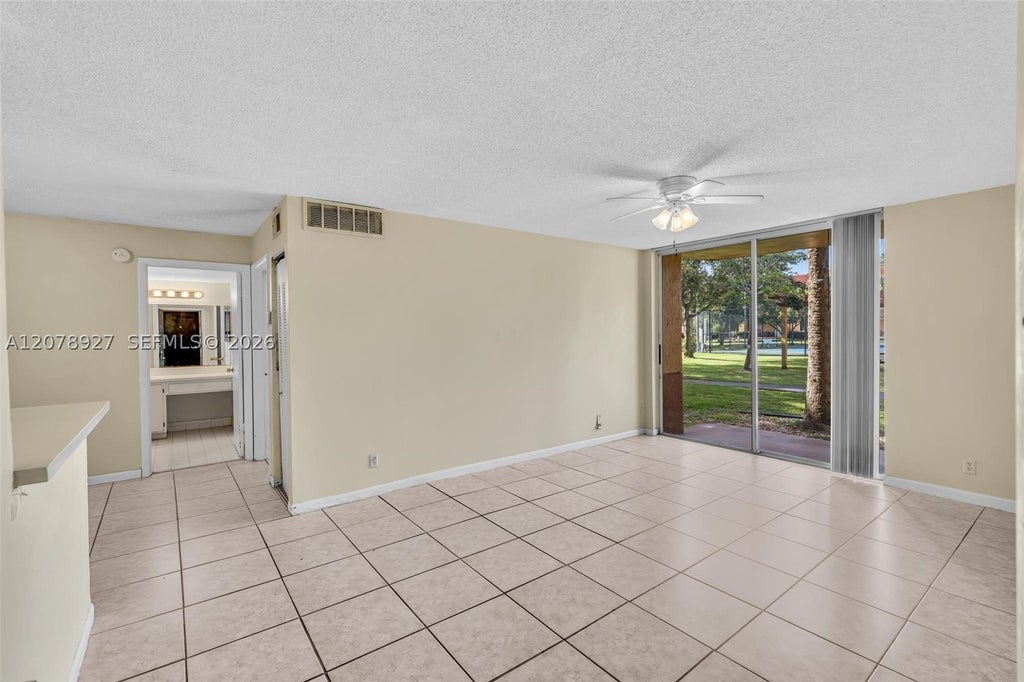 Photo of 10765 Cleary Blvd #104, Plantation, FL 33324 (MLS # A12078927)