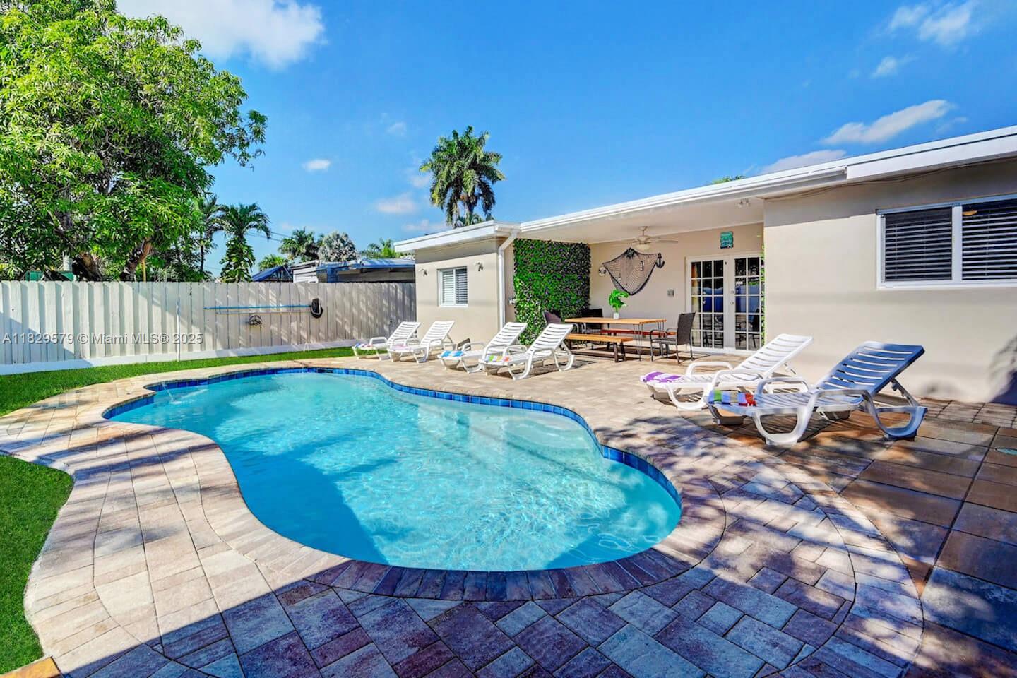 Great Location Heated Pool near Hollywood Beach 5-bedroom, 3-bath home in Hollywood Lakes!
This spacious and inviting residence is perfect for your next getaway.
It features an extra room with a comfortable reclining sofa bed, providing ample space for family and friends.
Enjoy the backyard oasis with a heated pool—your personal piece of paradise to relax and unwind. Experience comfort, style, and a warm welcome—book your stay today!
