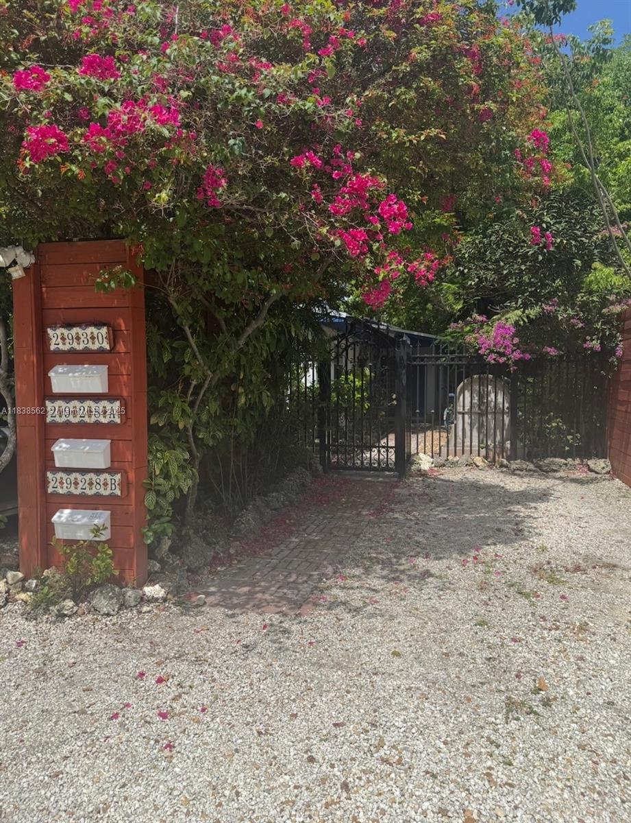 COZY, COMFORTABLE and UNIQUE apartment 2 Bed 1 bath, spacious kitchen, laundry room with private gated patio. Pet Friendly. Enjoy the nature in excellent location. Only steps to Coconut Grove Metrorail. 2 parking places. Rent includes water. Fast approval by owner.