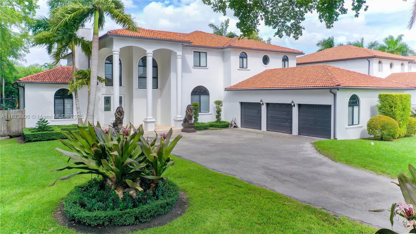 Stunning, modern executive pool home w/over 3/4 acre private corner lot and 3 car garage. Features 5/5, library, impact windows, double sided fireplace, high coffer ceilings, marble floors throughout main areas and hardwood bamboo floors in bedrooms. Shaker style kitchen with SS Kitchen Aid appliances, quartz counter top, cooking island. Bedroom with en suite downstairs. Dining, living and family rooms. Master bedroom with sitting area, his/hers walk-in closets & large bath. Tropical landscape.