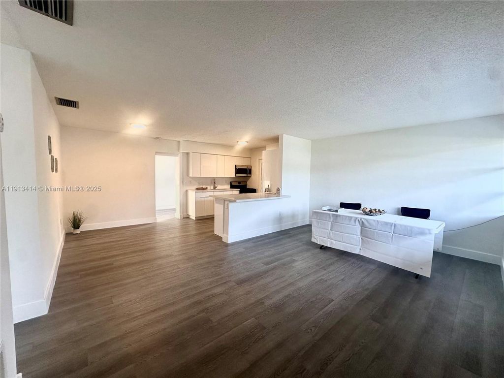 Photo of 9040 NW 26th Pl, Sunrise, FL 33322 (MLS # A11913414)