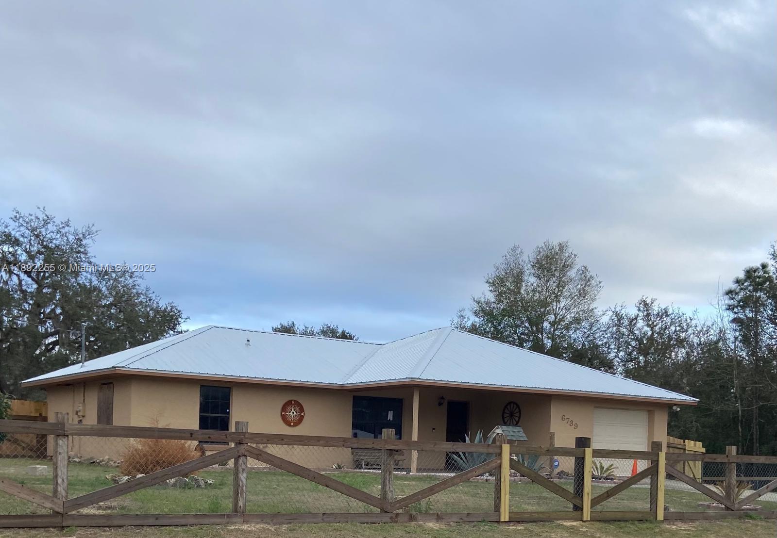 Experience the best of Ocala’s horse country in this charming 3-bedroom, 2-bath home on a full acre with private horse stables and spacious grounds. Perfect for riders, trainers, or anyone seeking a peaceful country lifestyle close to the World Equestrian Center and top competition venues. The open floor plan offers comfortable living and easy entertaining, while the outdoor spaces provide plenty of room for horses, family gatherings, and weekend relaxation. Ideal as a primary residence, seasonal getaway, or equestrian retreat, this property combines comfort, privacy, and proximity to everything that makes Ocala the Horse Capital of the World.