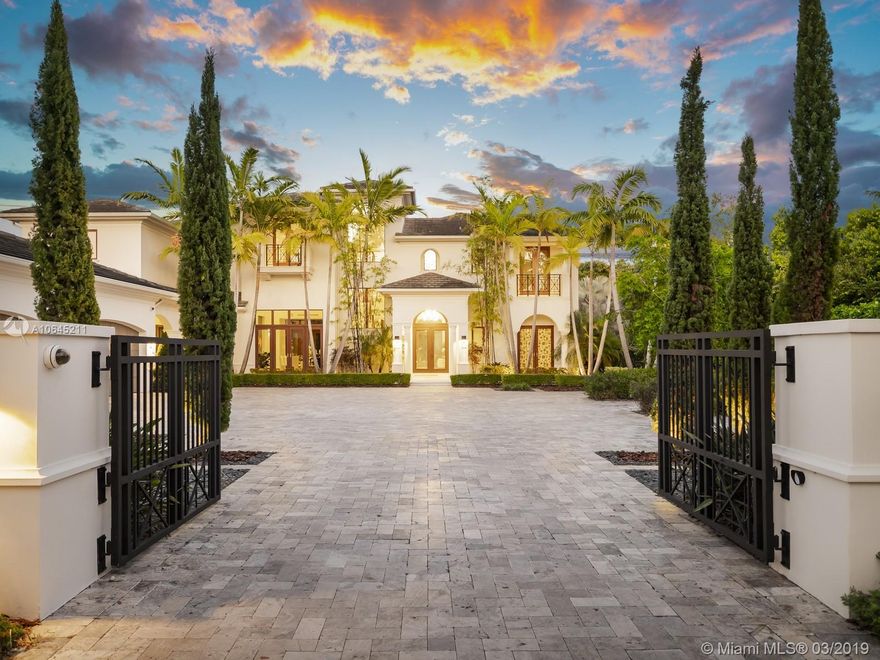 Magnificent Tropical Modern Estate in Prestigious Stritter Estates. Greeted by soothing water features as you enter your home which leads to a spectacular architectural floor plan w/plenty of natural light. This home offers luxurious finishes & incredible attention to detail throughout. Offering grand living & dining rooms, home theater area, MIA Cocina w/designer appliances, stunning glass stair case, LED shadow box art wall, upstairs master suite w/sitting areas & Zen bathroom, Nested on a deep lot allowing picturesque views of the backyard.  Features: Unique home office, large laundry room, LED Lights, Resort Style Pool, Concrete Roof, Oversized Summer Kitchen w/Brick Pizza Oven, 4-car garage + 1 car covered carport, Fully Gated. Premier Pinecrest Schools. Location, Location, Location