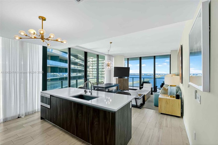 Gran Paraiso Unit 4407. This nearly 1,700 sq. ft. furnished three-bed, 3-bath + den with 9’ ceilings and floor-to-ceiling glass framing offering sweeping bay & city views. Semi-private elevator with private foyer entrance to the unit. Chef’s kitchen with Bosch & Sub-Zero opens to an oversized balcony ideal for sunrise coffee & sunset cocktails. Upgrades include blackout shades, custom closets & sound system on premises. Five-star amenities in a 55-story tower: private beach club, marina, tennis courts, pools, spa, fitness center & a restaurant by Chef Michael Schwartz. Designed by Arquitectonica with interiors by Piero Lissoni. Edgewater’s prime location is minutes from Downtown & Design District. Move-in ready!