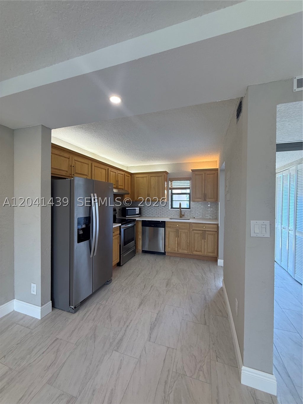 Photo of 9273 SW 8th St #311, Boca Raton, FL 33428 (MLS # A12041439)
