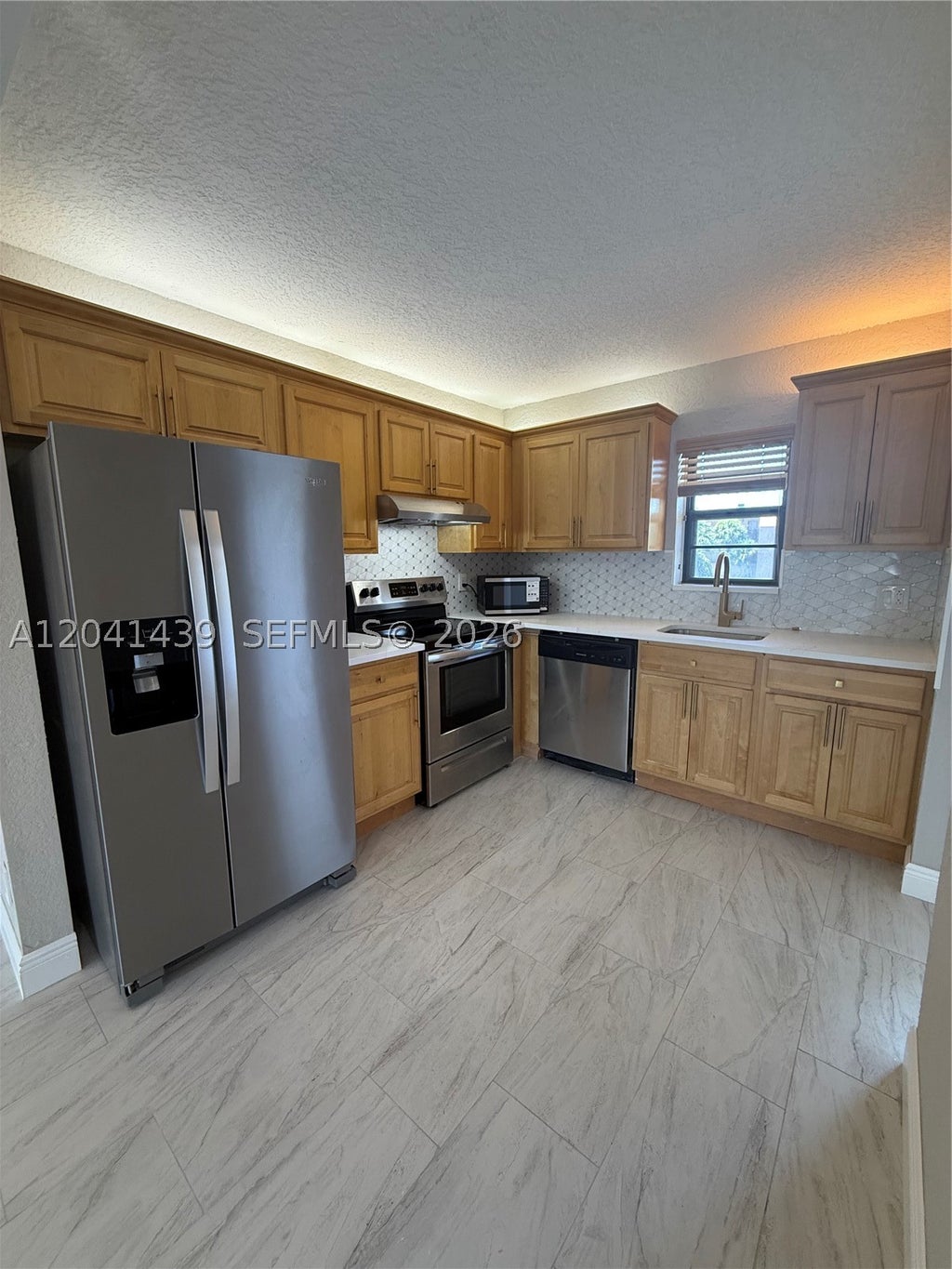 Photo of 9273 SW 8th St #311, Boca Raton, FL 33428 (MLS # A12041439)