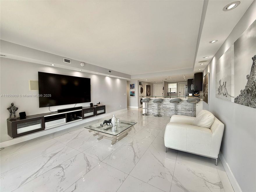 Step into luxury in this fully renovated and oversized 2-bedroom, 2-baths condo with high ceilings, abundant natural light, and elegant finishes throughout. The spacious open layout flows seamlessly into a stunning walkthrough shower, designer lighting, and premium flooring. Enjoy beautiful views of the iconic Coppertone sign, the shimmering pool, and a peaceful lake from your private balcony. Assigned parking included. Located in a gated community with excellent amenities. Easy access to Aventura, beaches, I-95, and more. Currently Rented 2300 per month