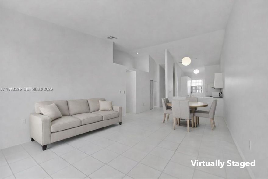 Spacious and well-maintained 2-bedroom, 2-bath townhome located in the established and desirable Country Lake Manors community. This residence offers an open layout with tile flooring throughout and vaulted ceilings that enhance natural light and living space. Enjoy a private fenced patio ideal for outdoor entertaining or relaxing. Two assigned parking spaces are conveniently located directly in front of the unit, with ample guest parking available. Community amenities include pool, tennis courts, playground, and 24-hour security patrol. Low monthly HOA includes common areas, roof maintenance, and amenities. Centrally located just minutes from Miami Lakes shopping, dining, major roadways, and everyday conveniences. Ideal for primary residence or investment.