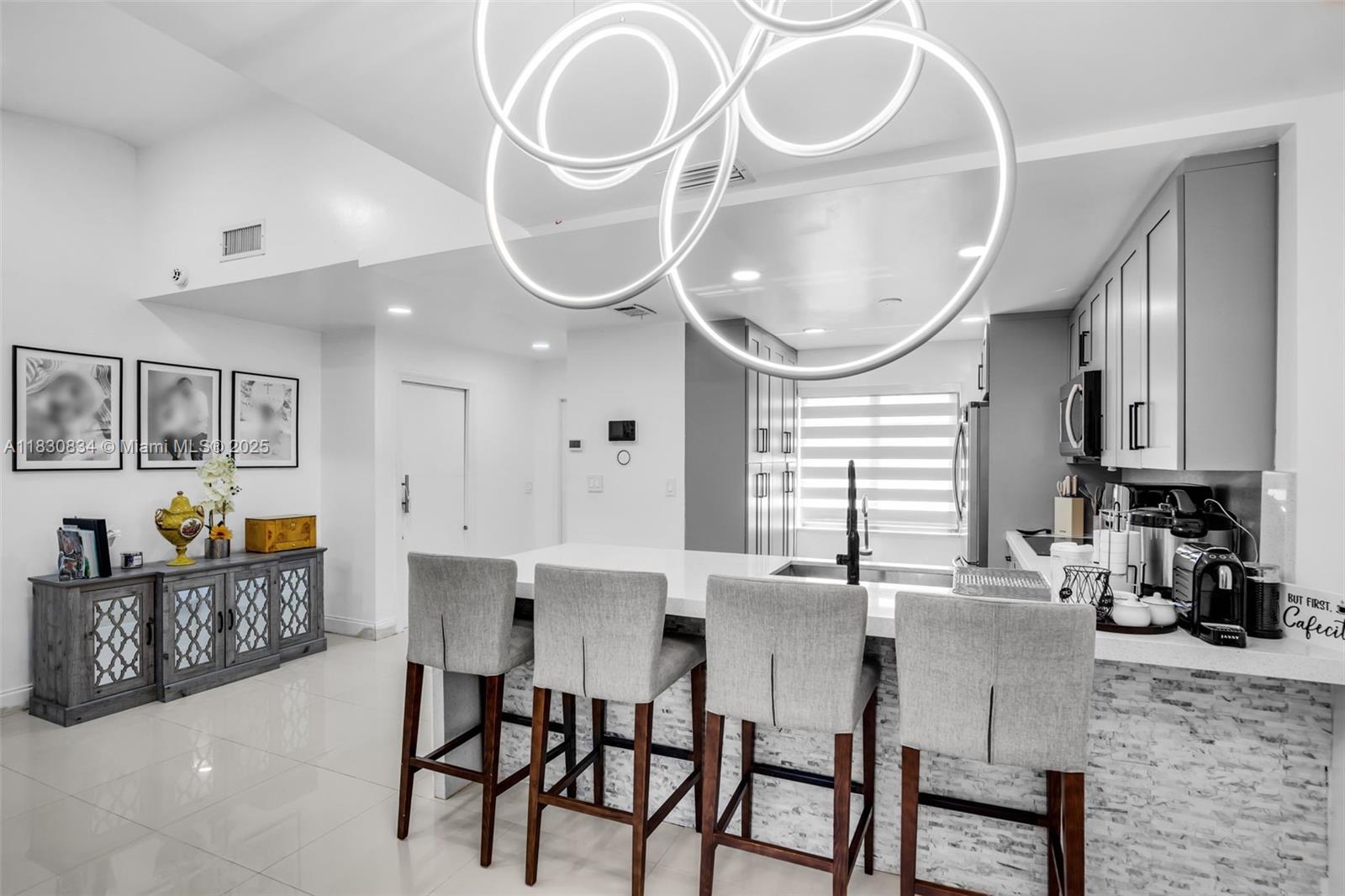 Completely remodeled 2-bedroom, 2-bathroom townhouse in the heart of Hialeah. This modern home features a spacious kitchen with plenty of counter space, perfect for cooking and entertaining. The open layout is filled with natural light and stylish finishes throughout. Enjoy a beautiful covered patio in the back—ideal for relaxing or hosting guests. Located just steps from the lake, this home offers both comfort and convenience in a peaceful neighborhood. Move-in ready and perfect for anyone seeking a modern lifestyle in a great location.