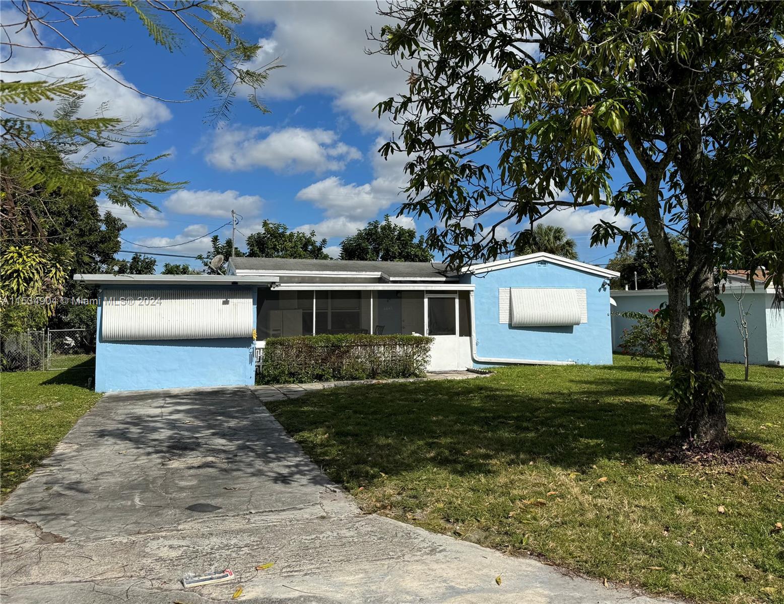 Discover this inviting 2-bedroom, 1-bathroom house featuring a spacious family area, central A/C, washer, dryer and its own gated backyard. Conveniently positioned just minutes from shopping centers, restaurants, beach, stadium, and airport, with Florida's Turnpike and I-95 easily accessible. This cozy home offers effortless access to all necessities. Home Owner requires first month, last month, and security deposit upon move-in. There are some furnishings at the home which are optional, the owner is open to removing furnishings upon request.