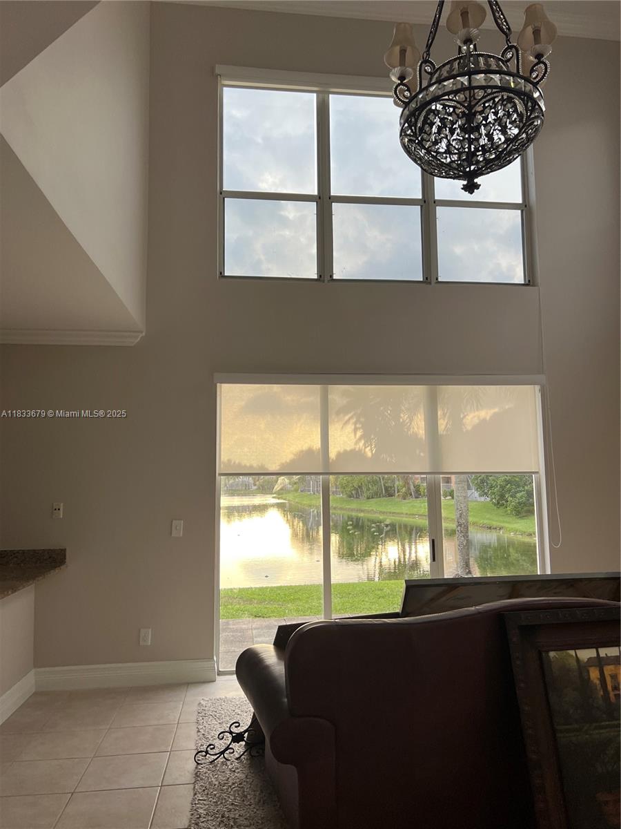 Beautiful, 4/2.5 lakefront house 2 car garage in desirable A+ school district. Gorgeous long lake front view in secure, quiet, gated Kensington community. Granite, Stainless Steel appliances, Real Wood cabinets, Roller shades and plantation shutters throughout first floor. Neutral tile floors, Large walk in master closet w/ensuite roman tub and separate shower. New Vanities with Quartz countertops in guest bathroom, Marble top Vanity in Master. First Floor 1/2 bath. Association maintained lawn care, irrigation from lake. Energy efficient appliances equals low Power bills. Large community pool, Publix and Costco next door. Community Park /playground within walking distance. Bike and walking trails surround community. Close to highways, shopping and restaurants.