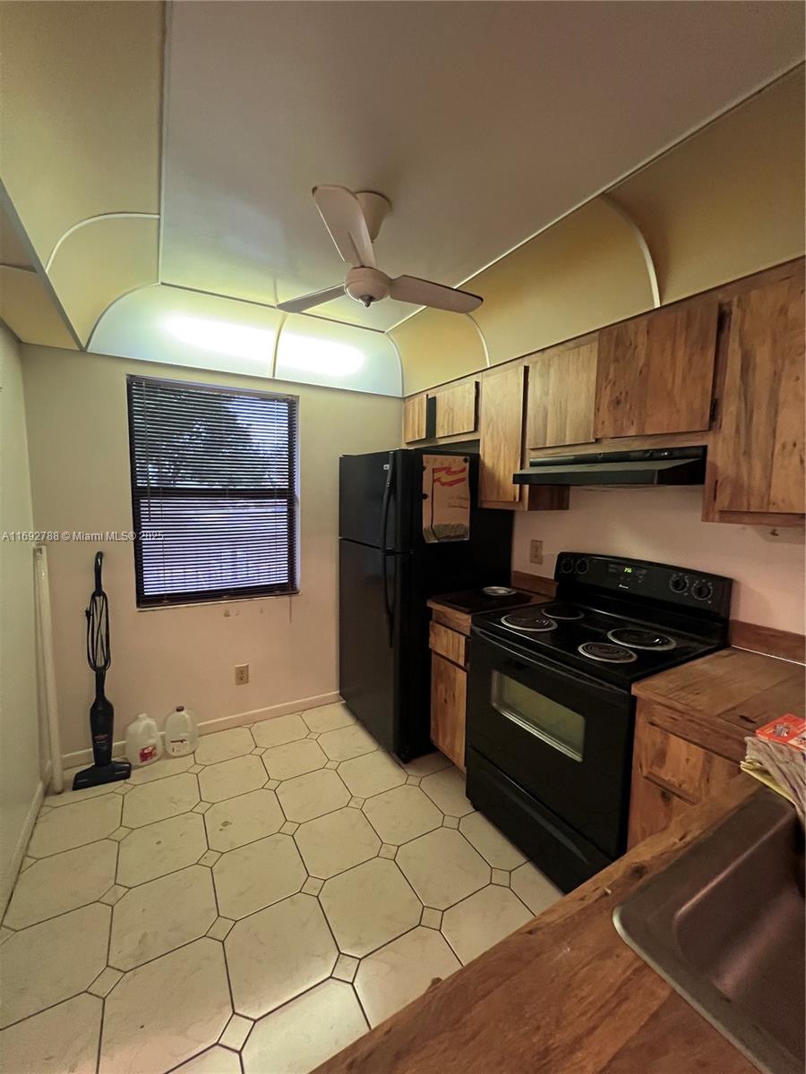 Perfect Winter Escape in Tamarac’s 55+ Community! This spacious 2-bedroom, 2-bathroom second-floor condo is ideal for seasonal residents or year-round living, featuring serene golf course views from a screened-in patio. With roomy interiors ready for your personal touch, this condo offers both potential and comfort. The active community boasts top amenities, including a heated pool, fitness center, clubhouse, tennis and pickleball courts, billiards, and regular social events—perfect for staying active and connected. Maintenance fees cover cable, water, and internet for added convenience. This condo is situated near shopping, dining, and major highways and provides an ideal blend of relaxation and accessibility. Priced to sell! Association approval is required.