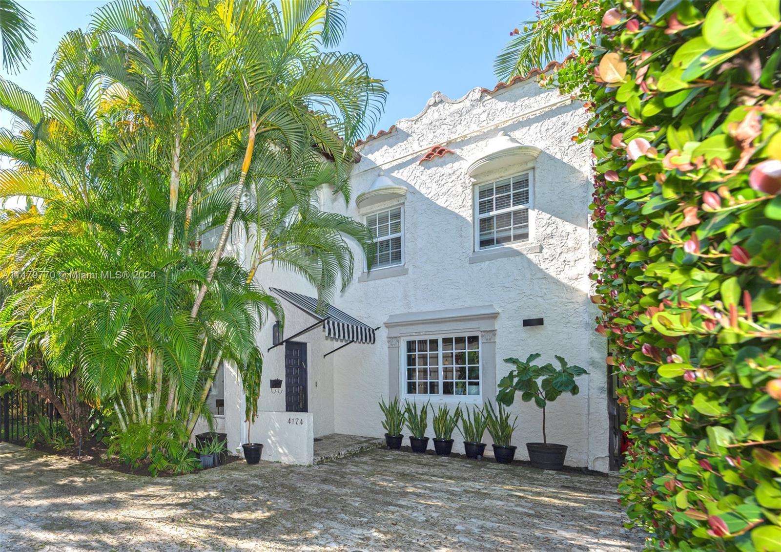 Spacious Mediterranean Villa nestled in the heart of Miami Beach. Step into the timeless allure of this 1924 home boasting hardwood floors, columns, archways, & original architectural detail. 5 BDR & 5.5 BA, w/ over 4,000 SF, a grand foyer, eat-in kitchen equipped w/ stainless steel appliances, dual sinks, & 6-burner gas stove. Wonderful layout w/ 4BDR up featuring a spacious primary bedroom w/ sitting room, balcony, walk-in closet, lg bath w/ dual sinks & spa shower. Feel the warmth of the inviting fireplace, while enjoying the natural light filtering through the impact windows. A guest cottage adds the perfect touch, great for visitors, office, or gym. Embrace the tranquility of this delightful property & envision the possibilities of infusing your personal touch into this charming home