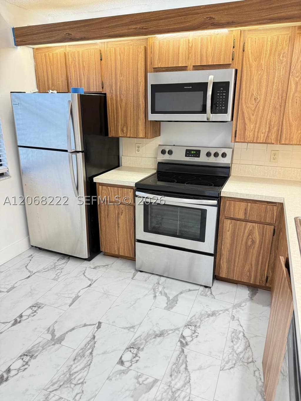 Photo of 3526 Whitehall Dr #302, West Palm Beach, FL 33401 (MLS # A12068222)