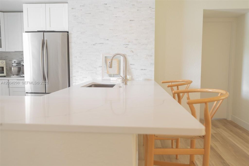 Photo of 3250 N Palm Aire Dr #202, Pompano Beach, FL 33069 (MLS # A12004298)