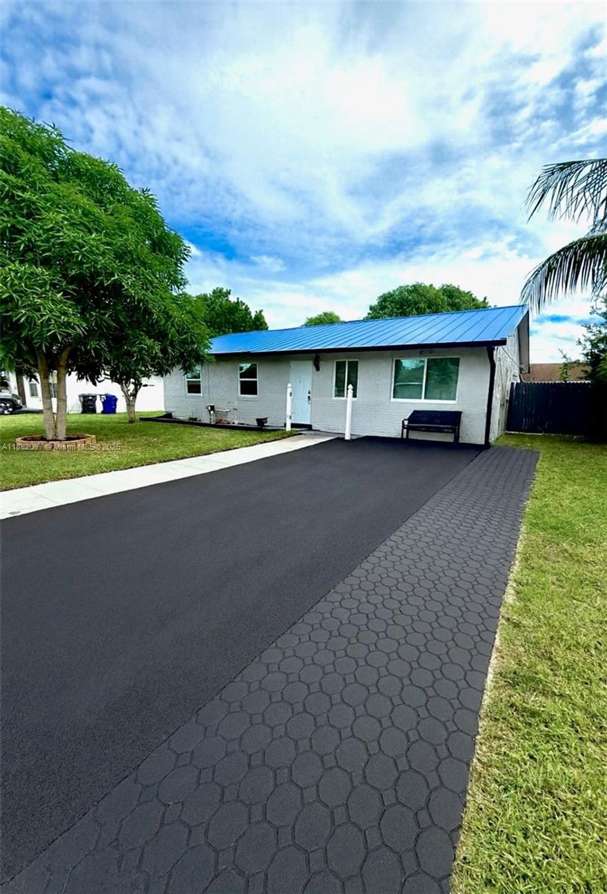 Welcome to this beautifully updated 3-bedroom, 2-bath home,  property features a fully renovated kitchen with a wall oven, cooktop, dishwasher, and modern fixtures, as well as bathrooms with new tiles and fixtures. The home boasts a brand-new blue metal roof, a freshly paved parking lot, and three new entry doors. New windows have been installed throughout, complemented by updated light fixtures and ceiling fans in every room. All electrical outlets, cover plates, and switches are new, and the interior and exterior have been freshly painted from floor to ceiling. Closets have been upgraded with brand-new shelving, the fence has been repaired and repainted, and a smart doorbell has been installed for added convenience and security.