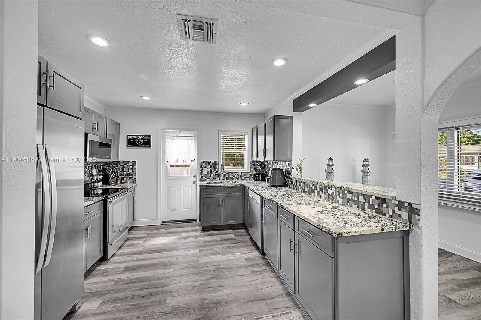 2BR/1BA home features a new kitchen, updated bath, fresh paint, and stylish modern finishes throughout. Near Downtown, Harbor, and Osprey Park! nestled in the heart of the Northwood Harbor Historic District, blending timeless character with an unbeatable location. Just minutes from vibrant downtown West Palm Beach, walking distance to the Intracoastal, Osprey Park, and Northwood Harbor. Enjoy peaceful strolls, weekend picnics, and evenings exploring the area's art, culture, and dining scene. Perfect for relaxing or entertaining, with easy access to highways, the Brightline, and PBI Airport. Whether you're looking for your first home or a seasonal investment, this one is ready to enjoy.