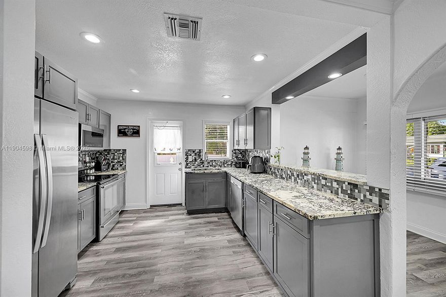 2BR/1BA home features a new kitchen, updated bath, fresh paint, and stylish modern finishes throughout. Near Downtown, Harbor, and Osprey Park! nestled in the heart of the Northwood Harbor Historic District, blending timeless character with an unbeatable location. Just minutes from vibrant downtown West Palm Beach, walking distance to the Intracoastal, Osprey Park, and Northwood Harbor. Enjoy peaceful strolls, weekend picnics, and evenings exploring the area's art, culture, and dining scene. Perfect for relaxing or entertaining, with easy access to highways, the Brightline, and PBI Airport. Whether you're looking for your first home or a seasonal investment, this one is ready to enjoy.