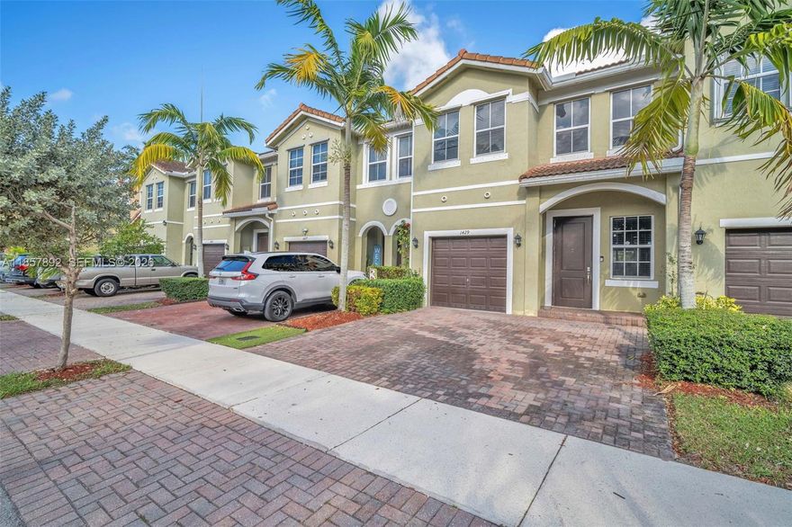 Step into modern comfort with this 4-bedroom, 3-bathroom townhome in the desirable Keys Garden community of Homestead. Built in 2018, this home features fresh flooring throughout (no carpet), stainless steel appliances, a walk-in pantry, and a spacious patio perfect for entertaining or relaxing. The main level offers a versatile bedroom and full bath ideal for guests, a home office, or multigenerational living. Enjoy the convenience of an attached garage and affordable HOA dues that include internet and cable. Move-in ready and meticulously maintained, this home combines style, comfort, and value. Schedule your showing today!