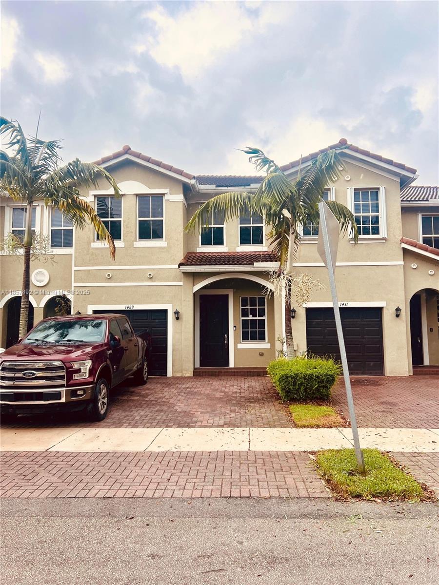 Step into modern comfort with this 4-bedroom, 3-bathroom townhome in the desirable Keys Garden community of Homestead. Built in 2018, this home features fresh flooring throughout (no carpet), stainless steel appliances, a walk-in pantry, and a spacious patio perfect for entertaining or relaxing. The main level offers a versatile bedroom and full bath ideal for guests, a home office, or multigenerational living. Enjoy the convenience of an attached garage and affordable HOA dues that include internet and cable. Move-in ready and meticulously maintained, this home combines style, comfort, and value. Schedule your showing today!