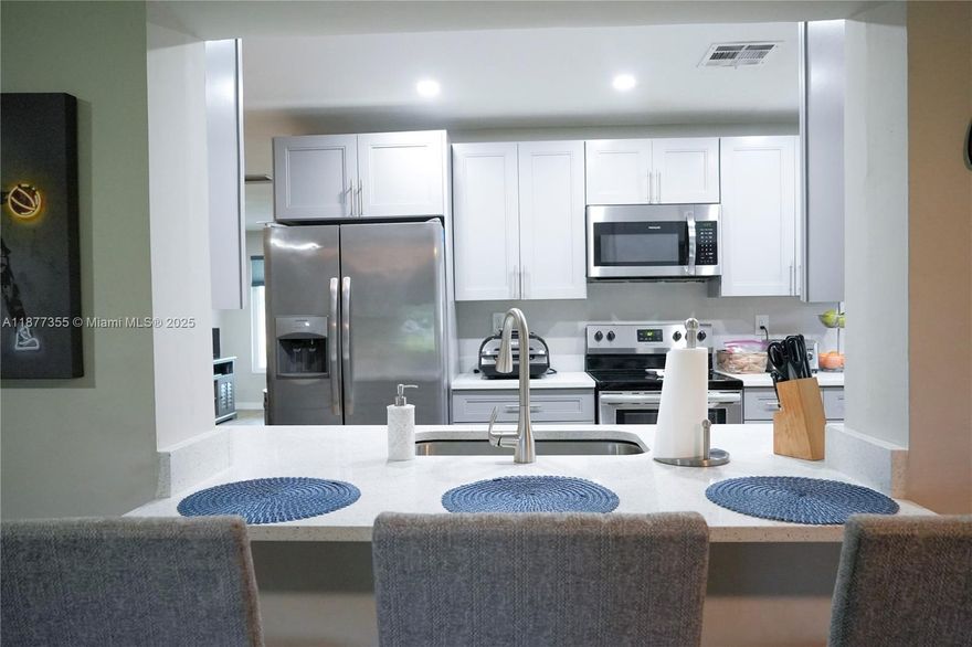 Here is a great opportunity to own a fully remodeled home in The Mainlands of Tamarac. This is a 55+ section of The Mainlands and is ready for a new owner to love this home as much as the current owners do. Fully remodeled home including a beautiful kitchen with quartz countertops and stainless steel appliances, separate laundry room, impact windows and doors, custom closets and more. Do not miss this opportunity to own this amazing home in the sought after Mainlands of Tamarac.