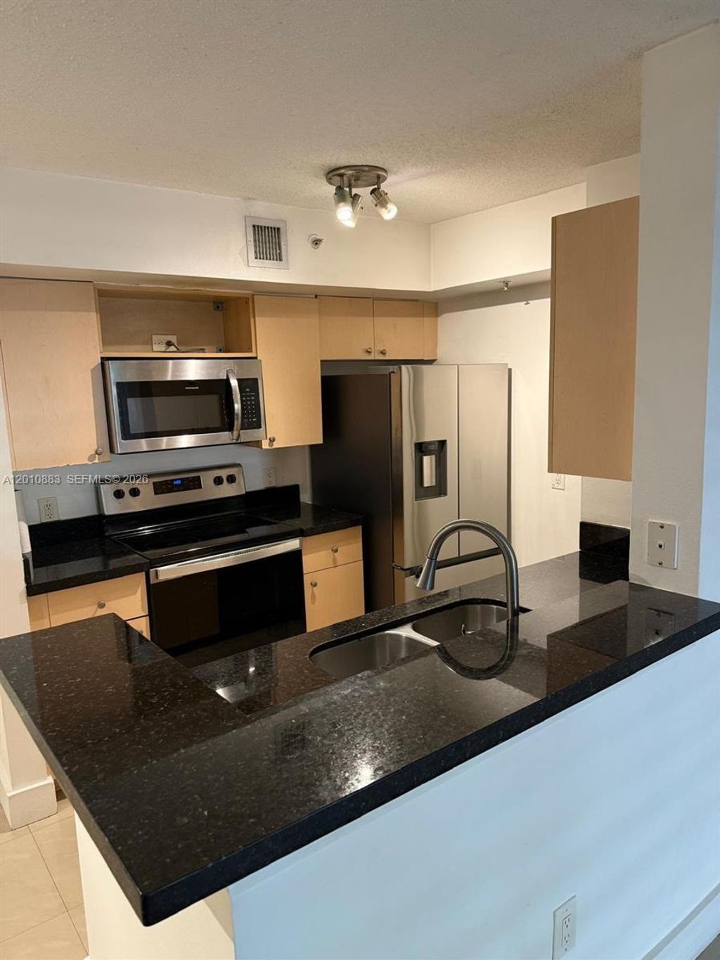 Photo of 2433 Centergate Dr #107, Miramar, FL 33025 (MLS # A12010883)