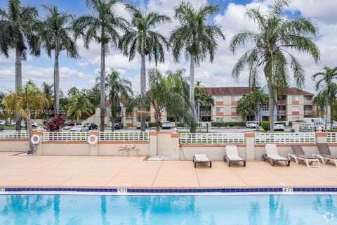 Photo of 18890 NW 57th Ave #210, Hialeah, FL 33015 (MLS # A11915780)