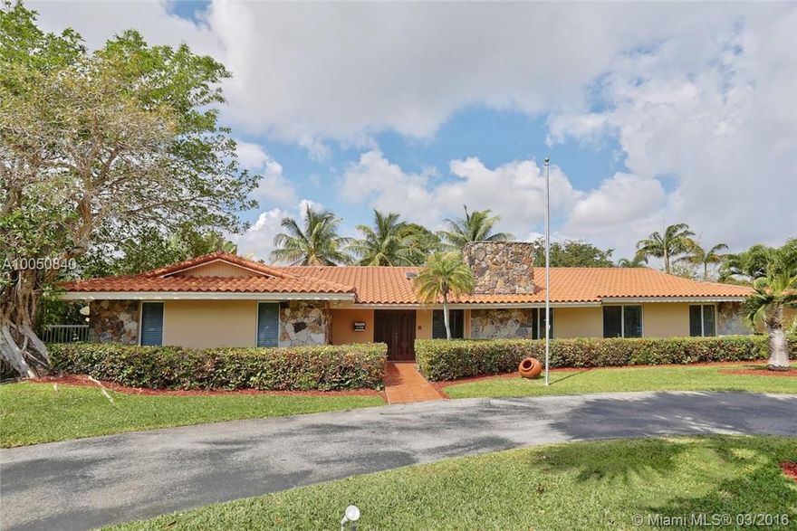 North Pinecrest Residence on over 1/2 acre corner lot with a pool.  Totally remodeled home with impact resist windows/doors, new tile floors throughout and wood floors in bedrooms. Kitchen with SS appliances, Elf system closet organizers. Huge family room, fireplace, laundry room. Covered terrace and cabana with BBQ.  Split bedrooms.  Circular driveway leading to 2 car garage. Sprinkler with well.  A Must See!