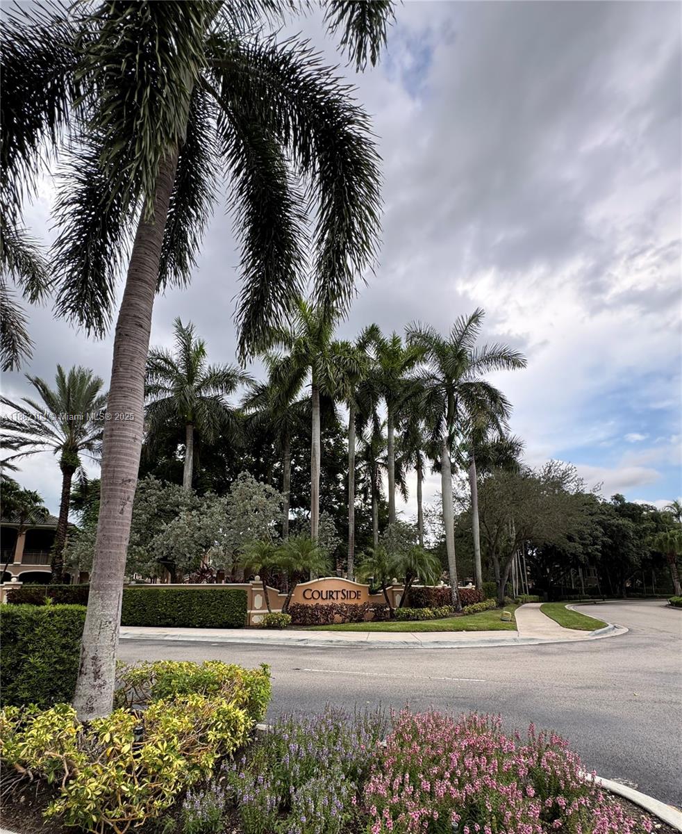 Experience luxury living in this 3 Bedrooms and 2 Bathrooms Residence in the exclusive Courtside at Weston Hills Country Club. Featuring an elegant split floor plan with updated kitchen and floors, spacious living areas, and hurricane impact windows/doors. Enjoy a private wraparound courtyard with lush landscaping, a 2-car garage with private driveway, and EV charger. Nestled in a gated community, just steps from Weston Hills Golf & Country Club (membership required) and Town Center’s fine dining and shops. A rare opportunity to enjoy South Florida living at its finest!
