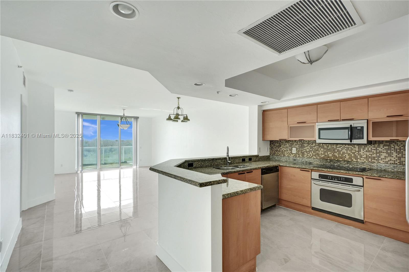 Welcome to this beautiful 1,801 sqft residence on the 8th floor—offering privacy & tranquil tree & skyline views that will never be obstructed. Enjoy your morning coffee on the newly installed glass balcony. This split floor plan features sleek new porcelain floors throughout, newer washer/dryer, & freshly painted. The oversized primary suite includes a large walk-in closet and an en-suite bath & a jacuzzi tub. Assigned covered parking in the garage, plus the option to rent a second space for $68 monthly. Laundry room with washer/dryer in unit. Amenities include: heated pool, gym, tennis court, playground, dog wash station, and high-speed internet/cable included. Close to everything- Costco, Target, Publix, Mater Academy, UM Health, Pura Vida, Reserve Paddle, and the beach is minutes away!