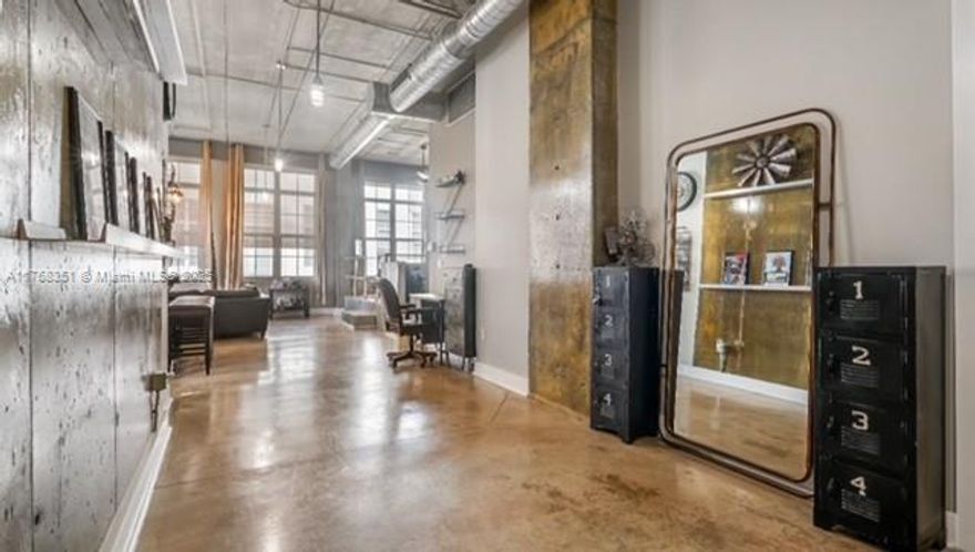 This rarely available, top-floor corner NY-style loft in Flagler Heights features soaring 14 ft ceilings and expansive hurricane impact windows showcasing stunning city views. The open layout boasts sleek concrete floors, stainless steel appliances, custom lighting, ceiling fans, a customized walk-in closet, and an in-unit washer and dryer. The fully renovated bathroom adds a touch of luxury. Located on the pool deck, this unit offers easy access to the massive rooftop, featuring a renovated gym, heated pool, BBQ, and lounge with skyline views. Surrounded by top dining, breweries, grocery stores, nightlife, Las Olas, and Brightline for easy travel to Miami and West Palm. Pet-friendly with secure gated parking—this is city living at its finest!