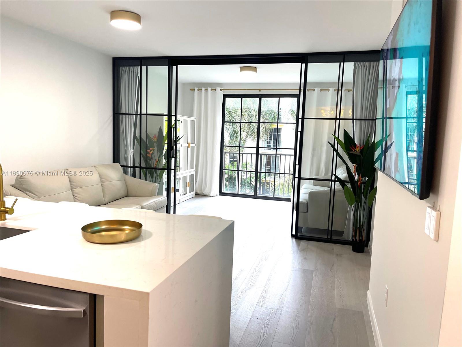 Experience this stunning, FULLY FURNISHED condo at CityPlace Shops, just minutes from the beach! Immaculate and turnkey, this recently remodeled unit features a versatile convertible glass wall that transforms into a bedroom, private office, or cozy guest space—perfect for professionals or families. Enjoy all new appliances, including a 75" Samsung TV and a 55", two full leather queen sofa beds, and a luxurious King Casper bed. Custom cabinetry and all gold fixtures add elegance. The community permits seasonal Airbnb and vacation rentals, with condo reserves and passed all milestone inspections. Minutes from the airport, walking distance to Brightline station, Kravis Center and Convention center. Your perfect beachside getaway awaits!