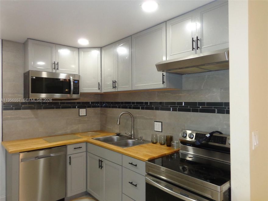 Priced to Sell!!! Beautifully remodeled first-floor condo available for Sale in the all-ages community of Manors of Inverrary. This spacious unit features a modern kitchen with stainless steel appliances, granite countertops, and new cabinetry. Bathrooms have been updated with ceramic tile, new vanities, and contemporary fixtures. Enjoy large tile flooring throughout, a split-bedroom layout, walk-in closet in the primary bedroom, and a screened-in patio. Top-of-the-line washer and dryer included. Well-maintained community with convenient access to shopping, dining, and major roads.
