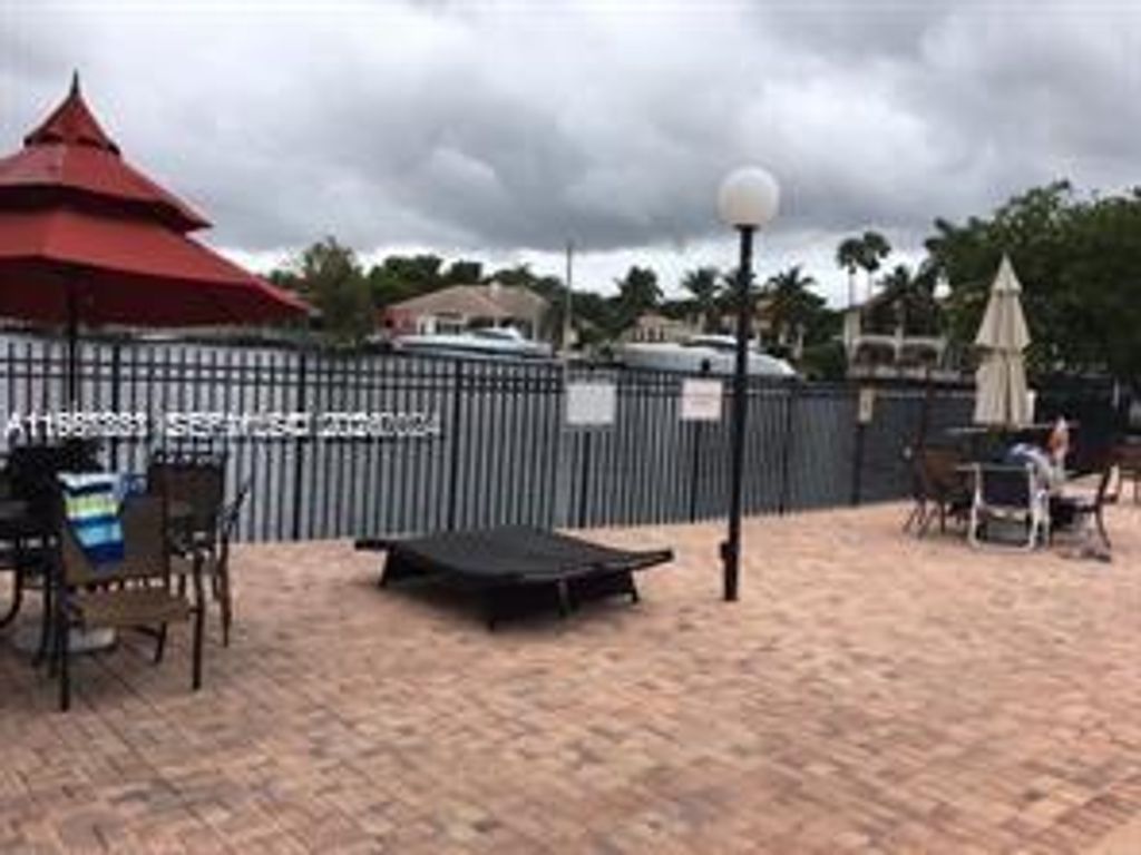 Photo of 851 Three Island Blvd #418, Hallandale Beach, FL 33009 (MLS # A11957861)