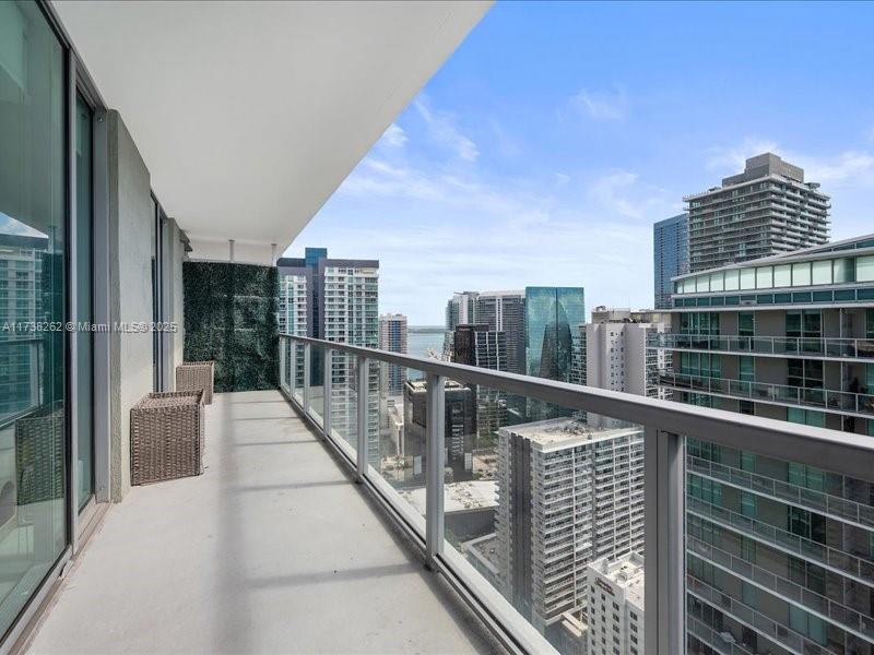 Rarely available Penthouse at Axis on Brickell North Tower! This is an excellent opportunity for first-time buyers or investors. The 1-bedroom, 1-bath unit features a fully remodeled bathroom, no carpet (easy-to-maintain flooring), a spacious balcony with stunning city views, and 2 tandem parking spots—a rare find for a 1-bedroom in Brickell. Includes private storage, low HOA fees, strong reserves, and approval for flexible financing. Enjoy resort-style amenities like a gym, pools, and more. Steps from the free Metromover, top dining, shopping, and transit. Don’t miss this perfect mix of luxury, convenience, and value!